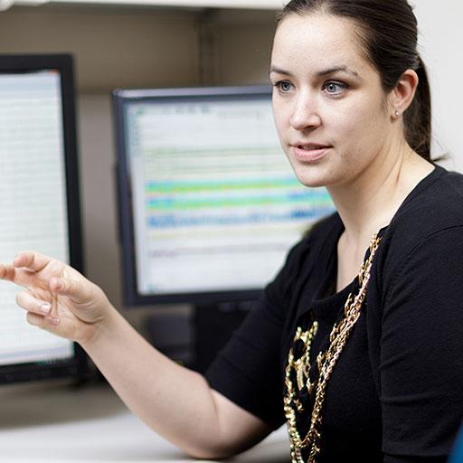 Physician examining an EEG scan with a patient