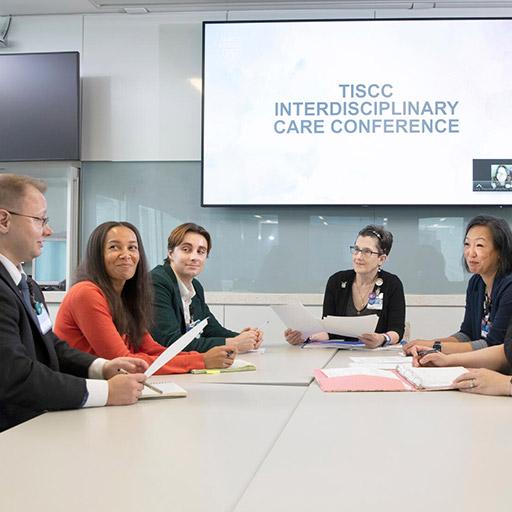 Endocrinology fellows and faculty in a meeting room at Mayo Clinic in Jacksonville, Florida, for the TISCC Interdisciplinary Care Conference.