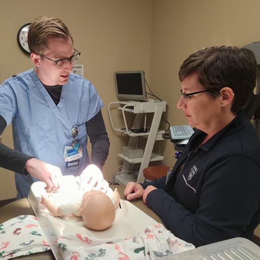 Family Medicine resident works with an infant patient at Mayo Clinic Health System in Mankato, Minnesota.