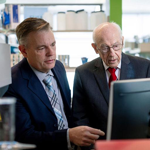 Hematology/Oncology fellow and faculty member working together on a computer at Mayo Clinic in Rochester, Minnesota.