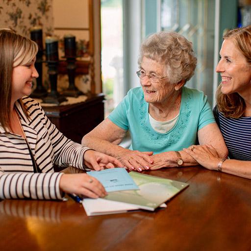 Hospice and Palliative Medicine fellow speaking with a patient and a family member in Jacksonville, Florida.