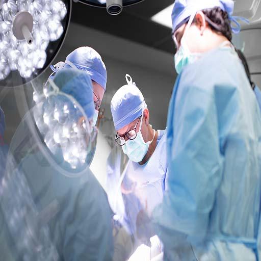 Eric Dozois, M.D. performing a surgery with colleagues.