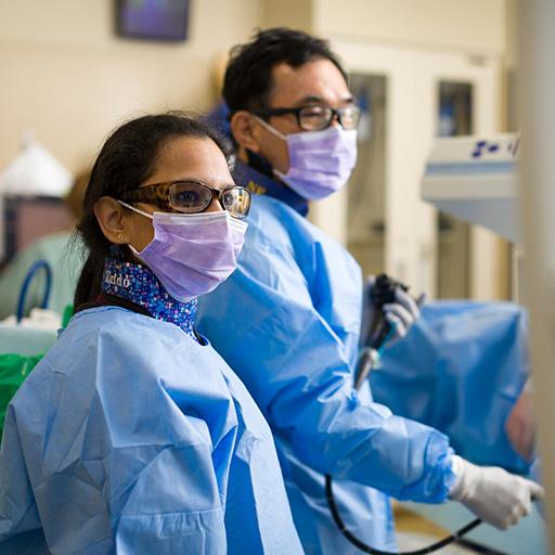 Two doctors from the Interventional Gastrointestinal Endoscopy Fellowship program in Arizona perform a procedure.