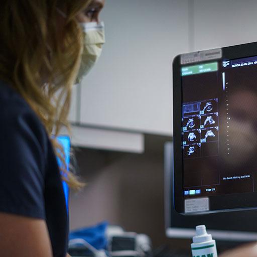 Maternal fetal medicine fellow completing an ultrasound on a patient