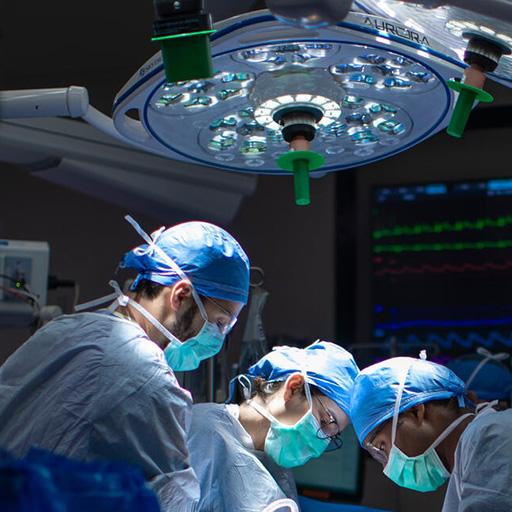 Resident and physician during surgery