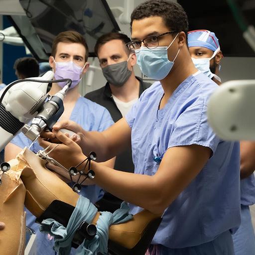 Residents honing knee arthroplasty skills in a simulation center