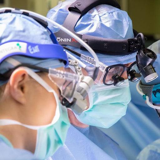 ENT residents work with Dr. Kasperbauer in the operating room