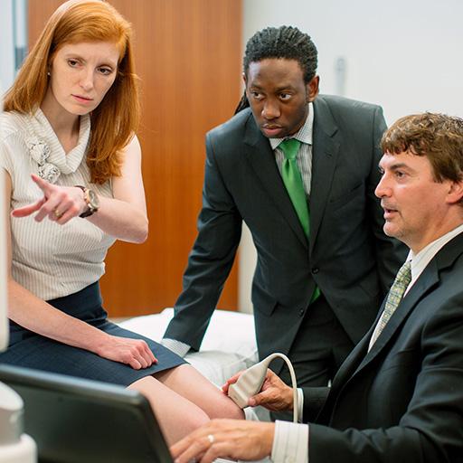 Mayo Clinic physical rehabilitation physicians examining a patient