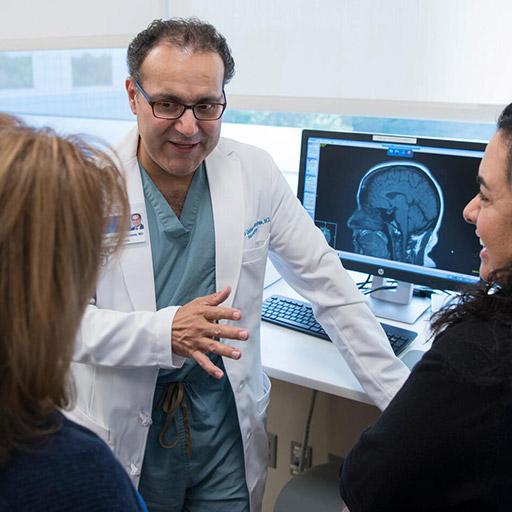 Plastic Surgery Integrated Residency faculty member talking to residents at Mayo Clinic in Jacksonville, Florida.