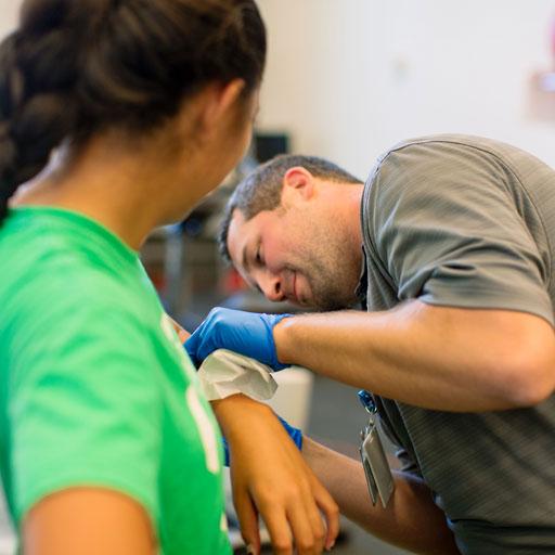 PM&R Sports Medicine fellow works with a patient at Mayo Clinic Square in downtown Minneapolis, Minnesota.