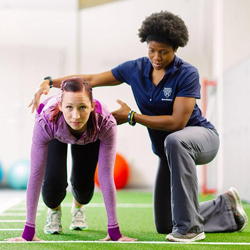 PM&R Sports Medicine fellow works with a patient at Mayo Clinic in Rochester, Minnesota.