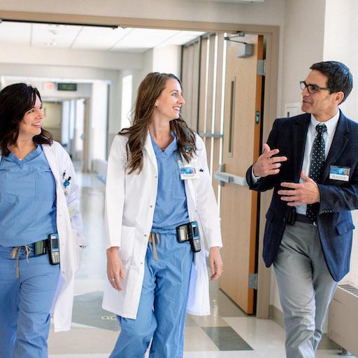 Surgical residents talk with a surgical faculty member at Mayo Clinic.