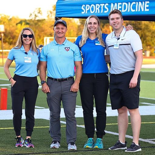 Four people from the Primary Care Sports Medicine Fellowship pose for a group photo.