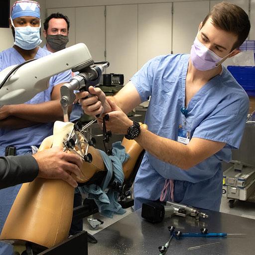 Orthopedic Surgery resident practices total knee arthroplasty bone cuts at the Center for Procedural Skills Mastery