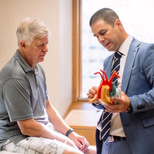 Pulmonary Hypertension fellow speaks with a patient. 