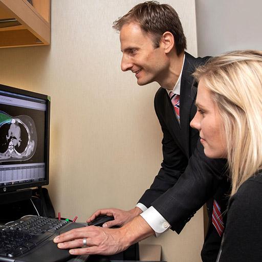Fellow working with proton equipment at Mayo Clinic in Rochester, Minnesota.