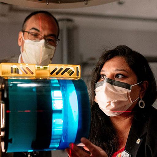A Mayo Clinic medical physicist inspects computed tomography equipment.