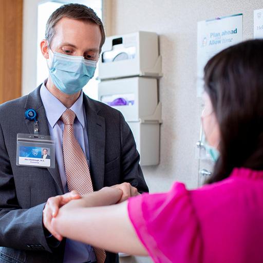 A fellow at Mayo Clinic's Rheumatology Fellowship program in Rochester, Minnesota, examines a patient.