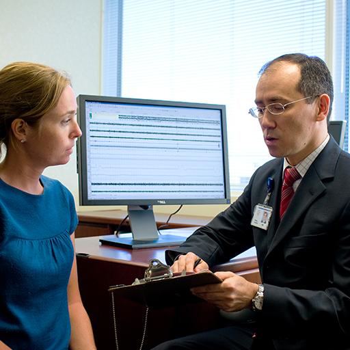 Sleep Medicine resident speaks with a patient. 