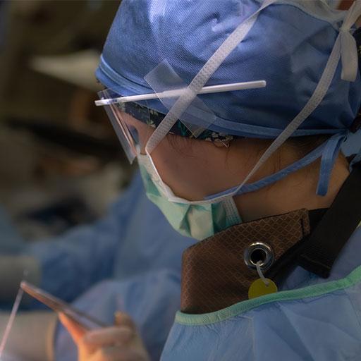 Dr. Lexi Wen operating on a patient with her mentor.