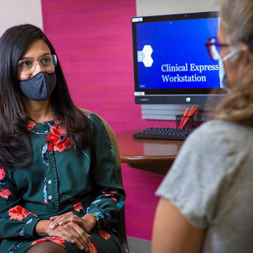 Women's Health fellow speaks with a patient at Mayo Clinic in Phoenix, Arizona.