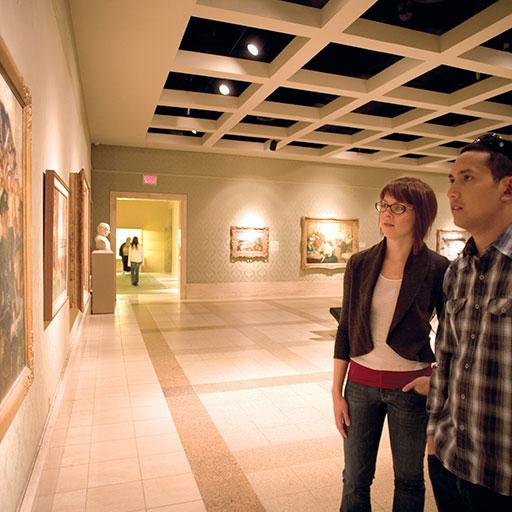 Two people looking at art exhibit at Cummer Museum in Jacksonville