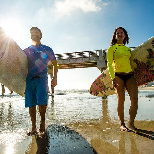 Two surfers on beach in Jacksonville
