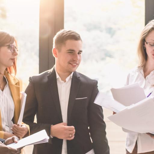 Six young business people analyzing results
