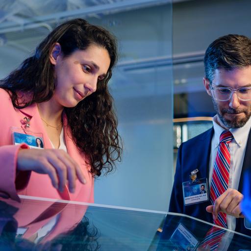 Artificial intelligence researchers working together with touch screen tablet