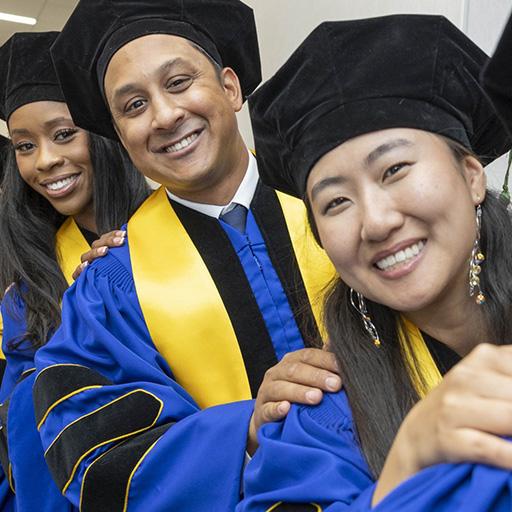 Mayo Clinic graduates line up and smile for a photo at 2026 Commencement in Florida