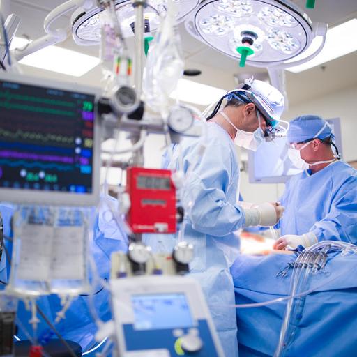 Physician and fellow work on a cardiovascular surgery in the operating room at Mayo Clinic