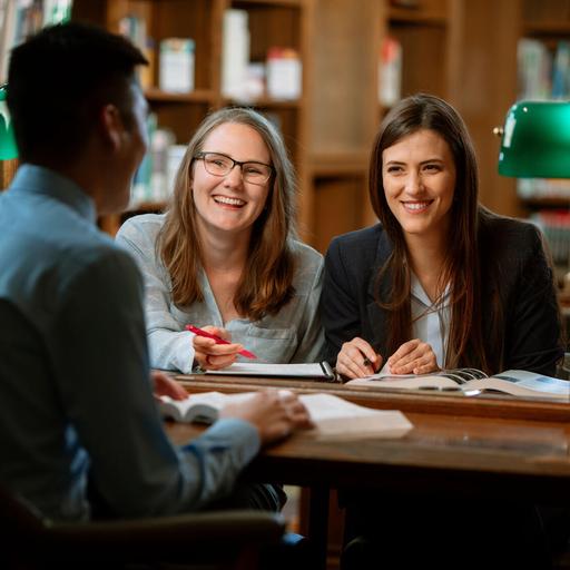 Three medical students at Mayo Clinic Alix School of Medicine study together in the library on the Mayo Clinic campus in Rochester, Minnesota.