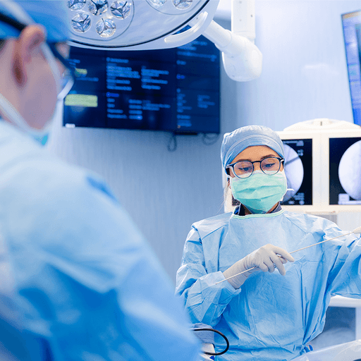 Surgeon prepares instrumentation for spine surgery