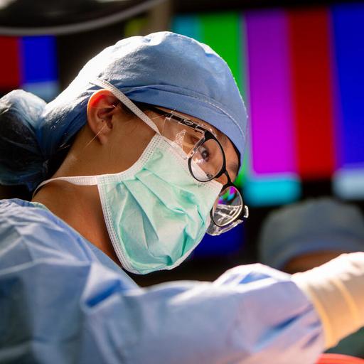 Surgical first assistant assists during a surgery in the OR at Mayo Clinic