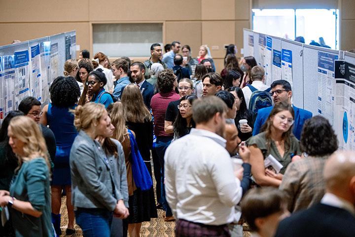 Crowds of students and faculty celebrate research at the 2023 Research Symposium