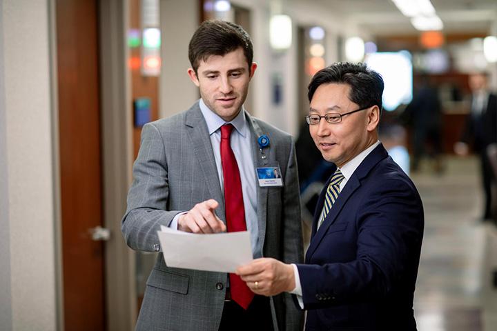 M.D.-Ph.D. student in the Medical Scientist Training Program speaks with a physician at Mayo Clinic