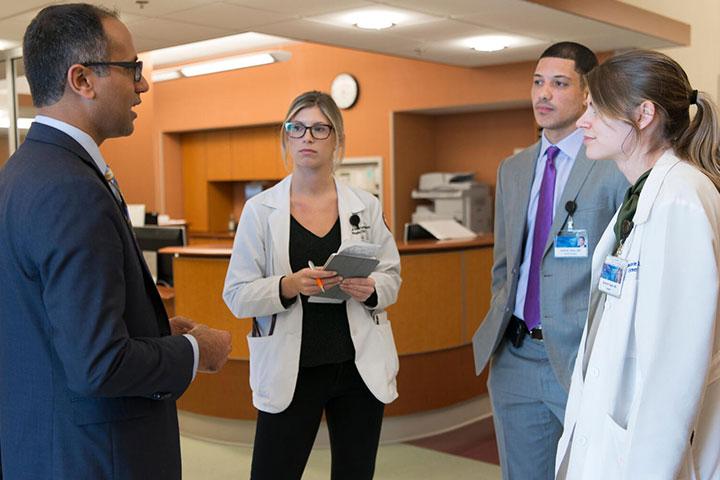 Colon and Rectal Surgery residents collaborate in the hallway at Mayo Clinic in Jacksonville, Florida.