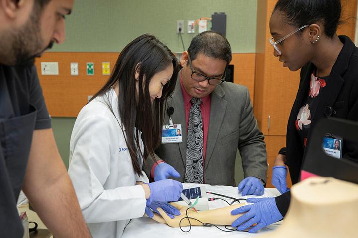 Four people from the Family Medicine Residency at Mayo Clinic in Jacksonville, Florida, for a demonstration.