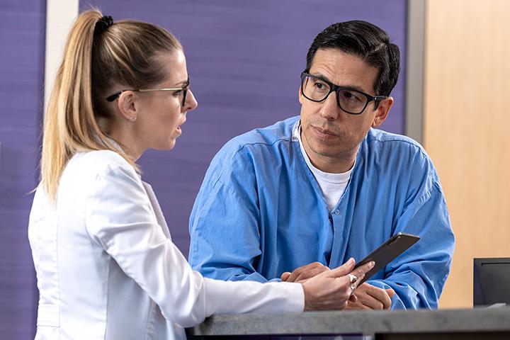 Two fellows from the Neurohospitalist Fellowship in Arizona looking at a tablet