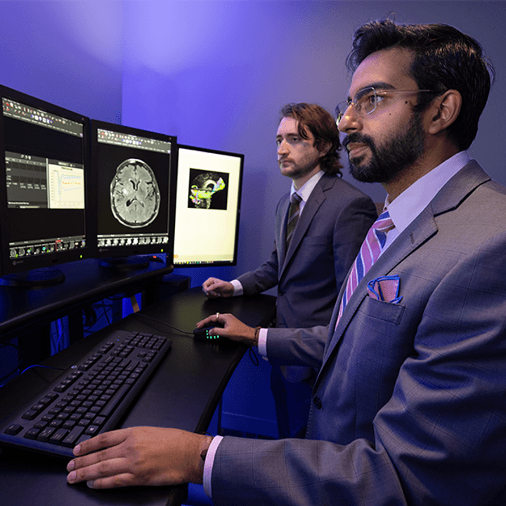 Neuroradiology fellows looking at scans