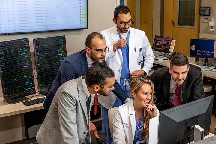 Mayo Clinic Orthopedic Surgery residents at a computer