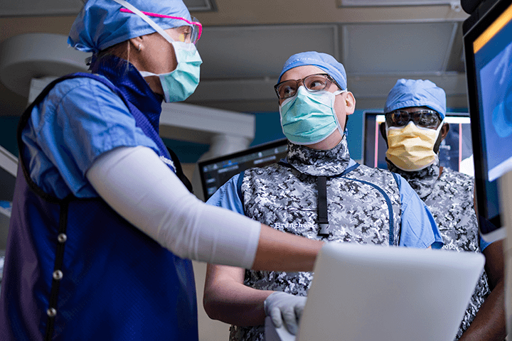 Fellows from Pulmonary and Critical Care Medicine Fellowship looking at computer screenter workstation