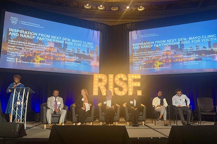 Rise for Youth presentation on a stage