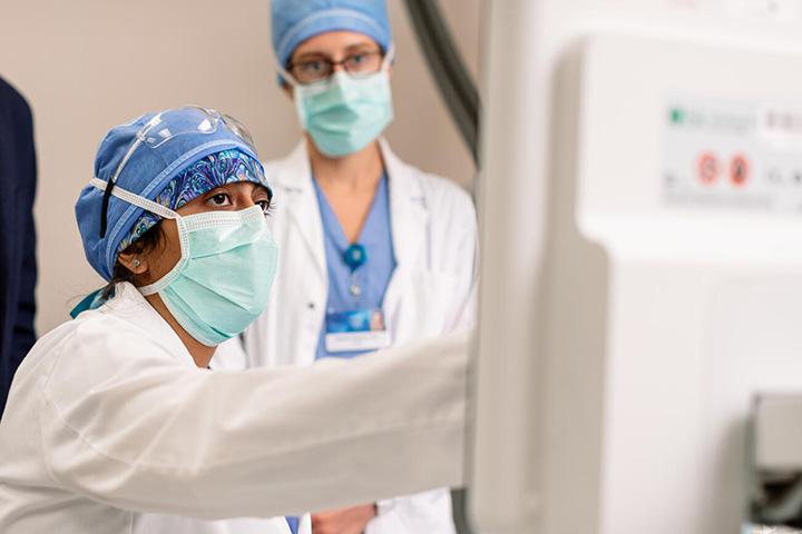 two people looking at computer monitor during discussion