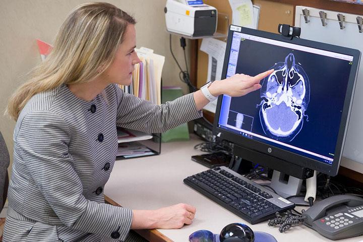 Allergy and Immunology fellow looks at a scan at Mayo Clinic in Phoenix, Arizona.
