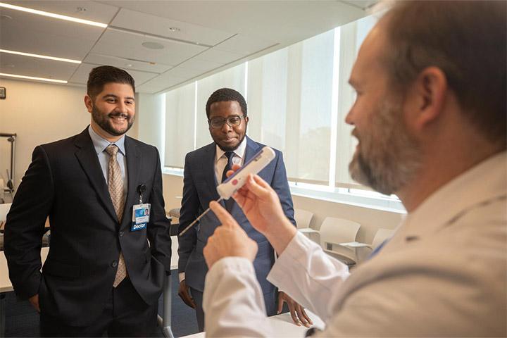 Body Imaging fellows and faculty talking at Mayo Clinic in Jacksonville, Florida.