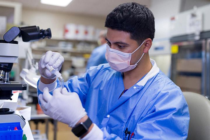 Clinical Microbiology fellow prepping culture specimens in the lab at Mayo Clinic in Rochester, MN.