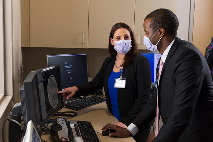 Mayo Clinic Clinical Neuropsychology fellows examining a brain scan