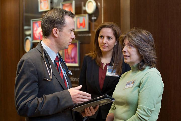 Endocrinology fellow and faculty member conversing in the hallway at Mayo Clinic in Rochester, Minnesota.