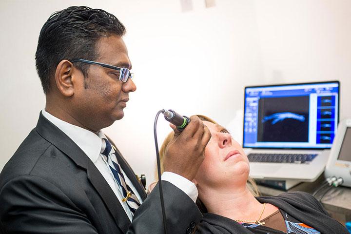 Glaucoma Fellowship Program Director, Syril Dorairaj, M.B.B.S., M.D., works with a patient at Mayo Clinic in Jacksonville, Florida.